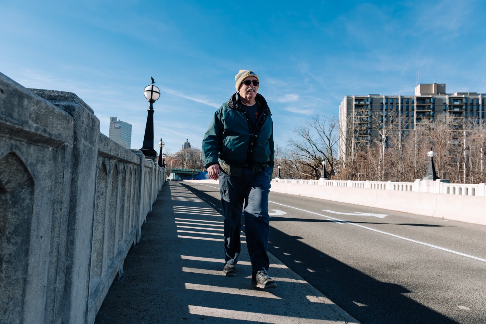 Mike Roeger walks the bridge on Saint Joe Boulevard near Conjure Coffee in Fort Wayne.