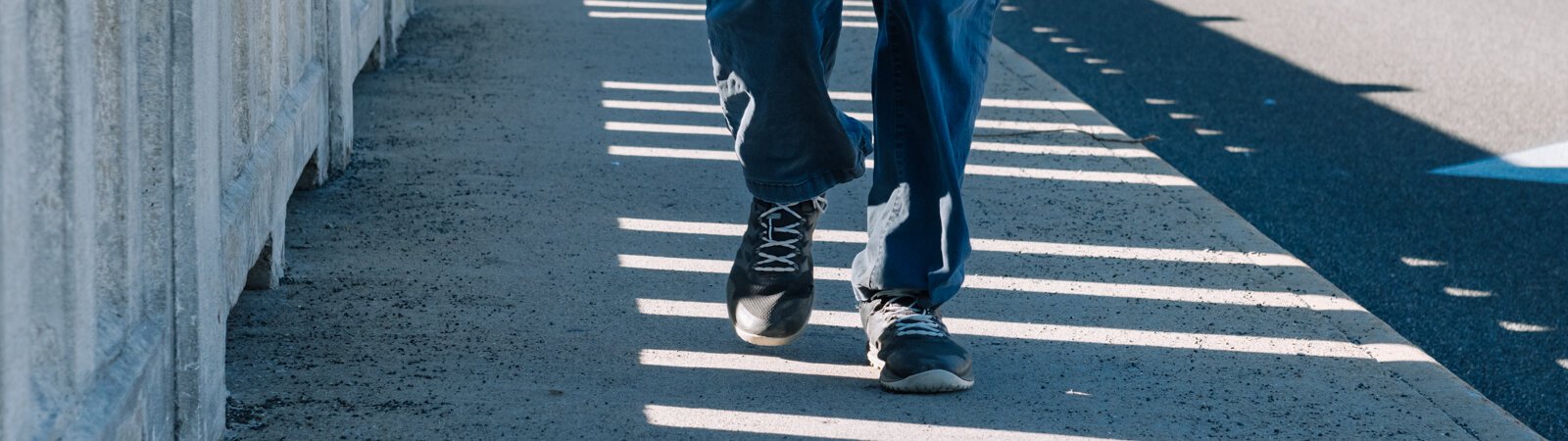 Mike Roeger walks the bridge on Saint Joe Boulevard near Conjure Coffee in Fort Wayne.