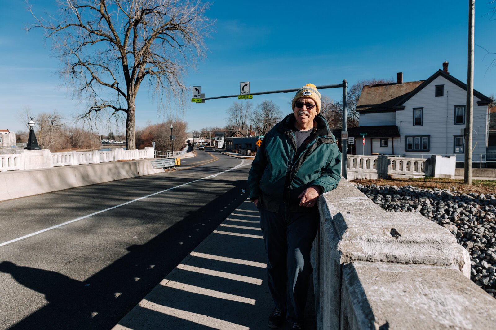 Mike Roeger walks the bridge on Saint Joe Boulevard near Conjure Coffee in Fort Wayne.