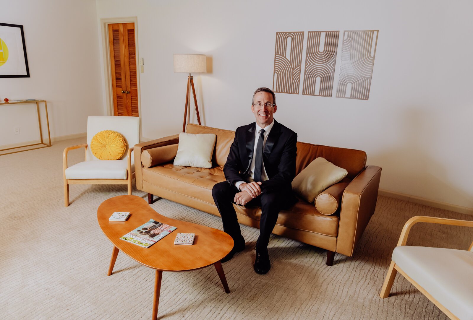Property owner Mike Kelly, in the living room of his Fort Wayne Airbnb, which is a recreation of Fawn Liebowitz's childhood home from the movie "Animal House."