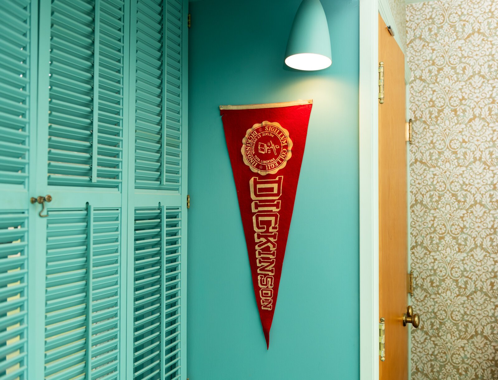 A Dickinson flag in a bedroom of the Airbnb, which is a recreation of Fawn Liebowitz's childhood home from the movie "Animal House."