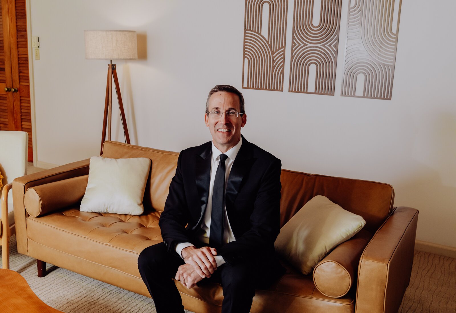 Property owner Mike Kelly, in the living room of his Fort Wayne Airbnb, which is a recreation of Fawn Liebowitz's childhood home from the movie "Animal House."