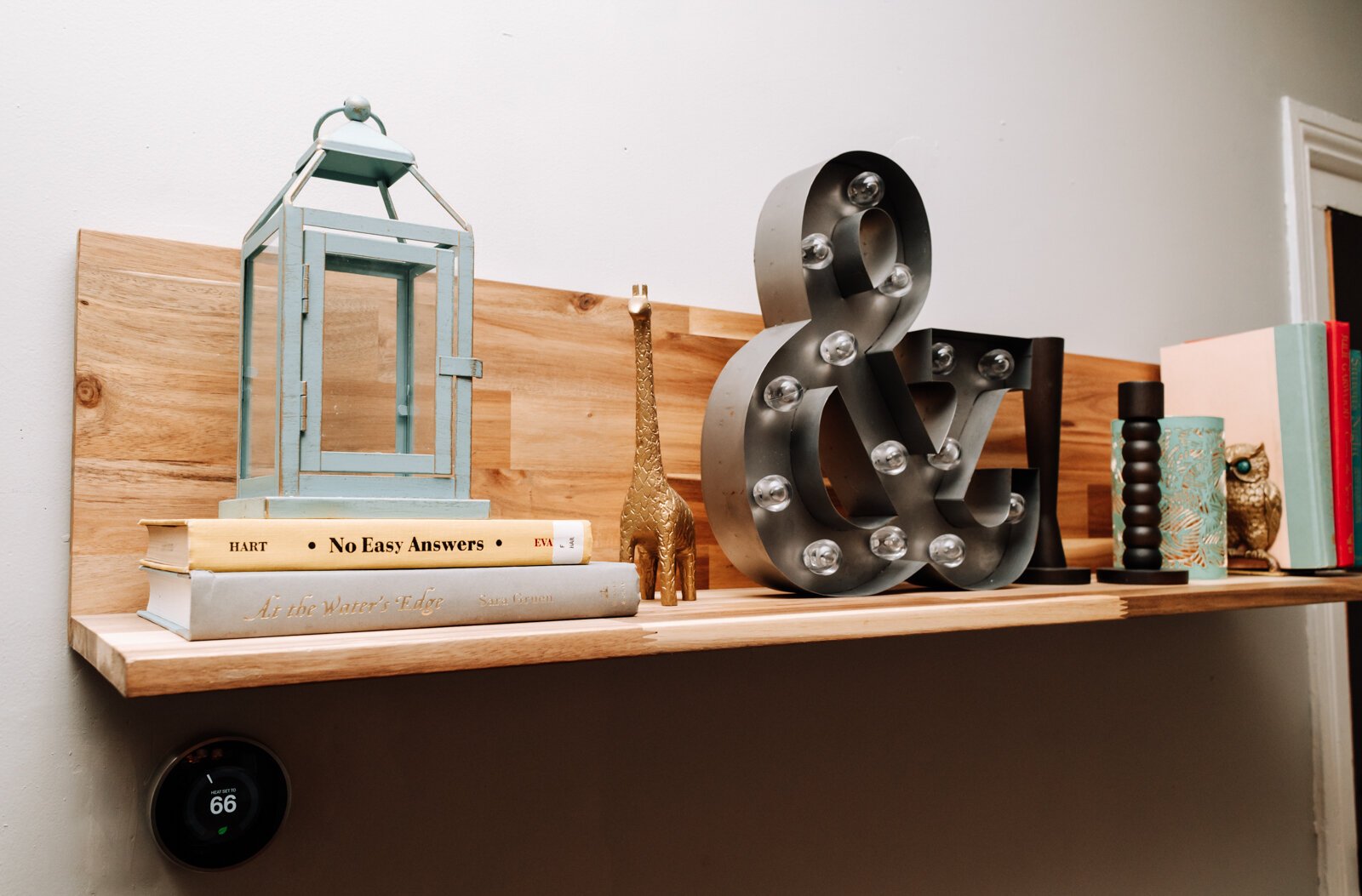 Shelves in the dining room at Kelley and Ryan's Airbnb are filled with decor and books.