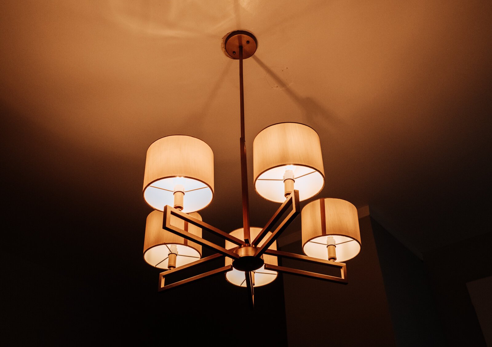 A light above the dining room table at the Airbnb owned by Kelly and Ryan Benton.