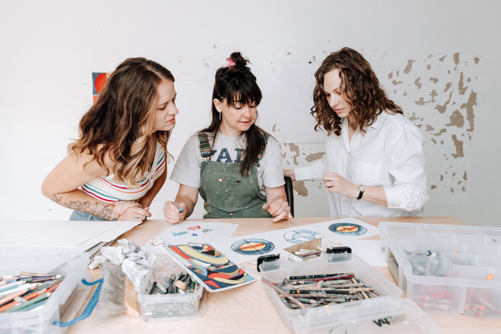 From left: Residency Founder & Co-Director of Kinhouse Gallery & Residency Kaylan Buteyn works with Sarah Wolfe, artist in residence, along with Dana Caldera, Co-Director of Kinhouse Gallery.
