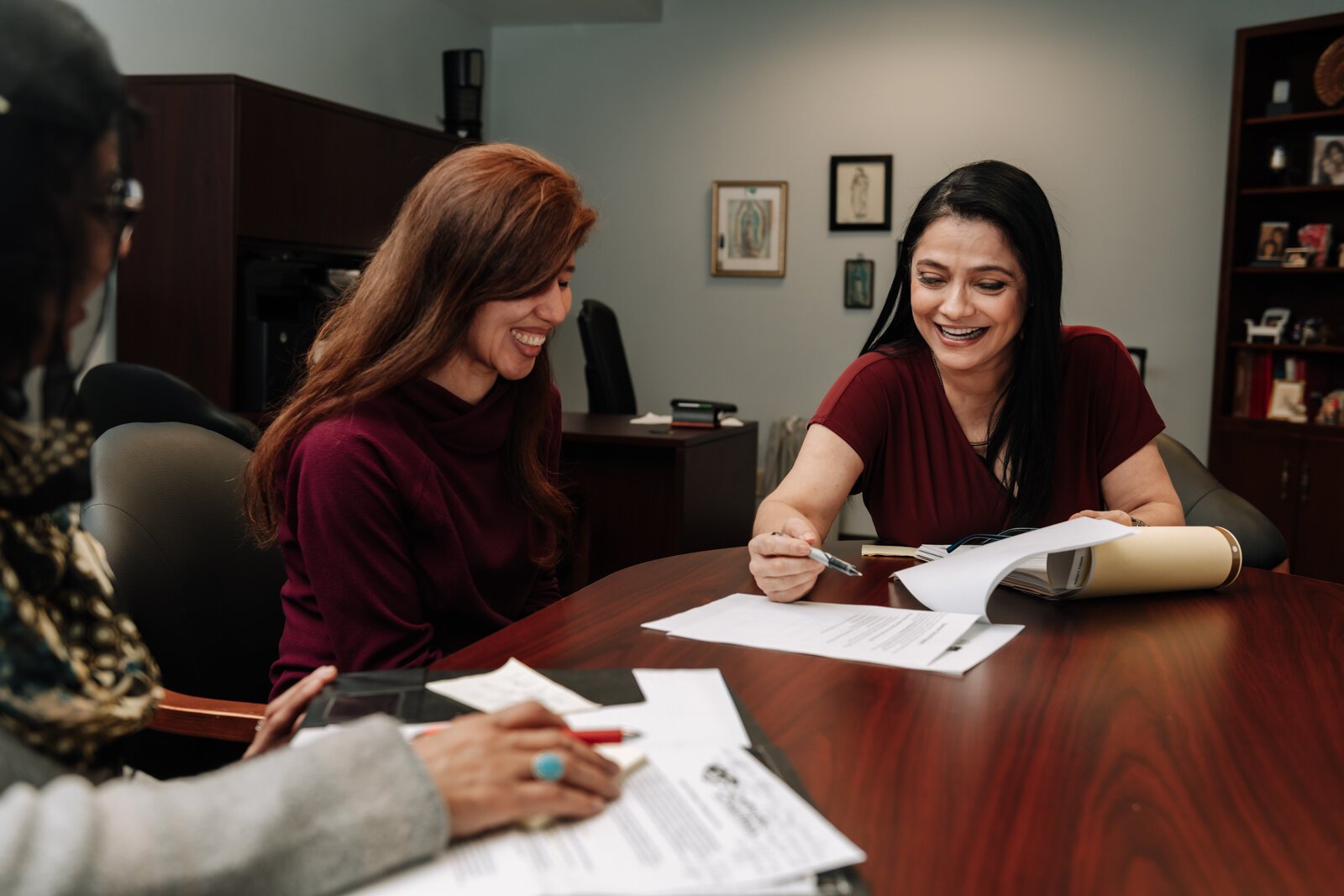 Luz Ostrognai with Catholic Charities demonstrates what a meeting with immigration clients would look like at the Archbishop Noll Catholic Center.