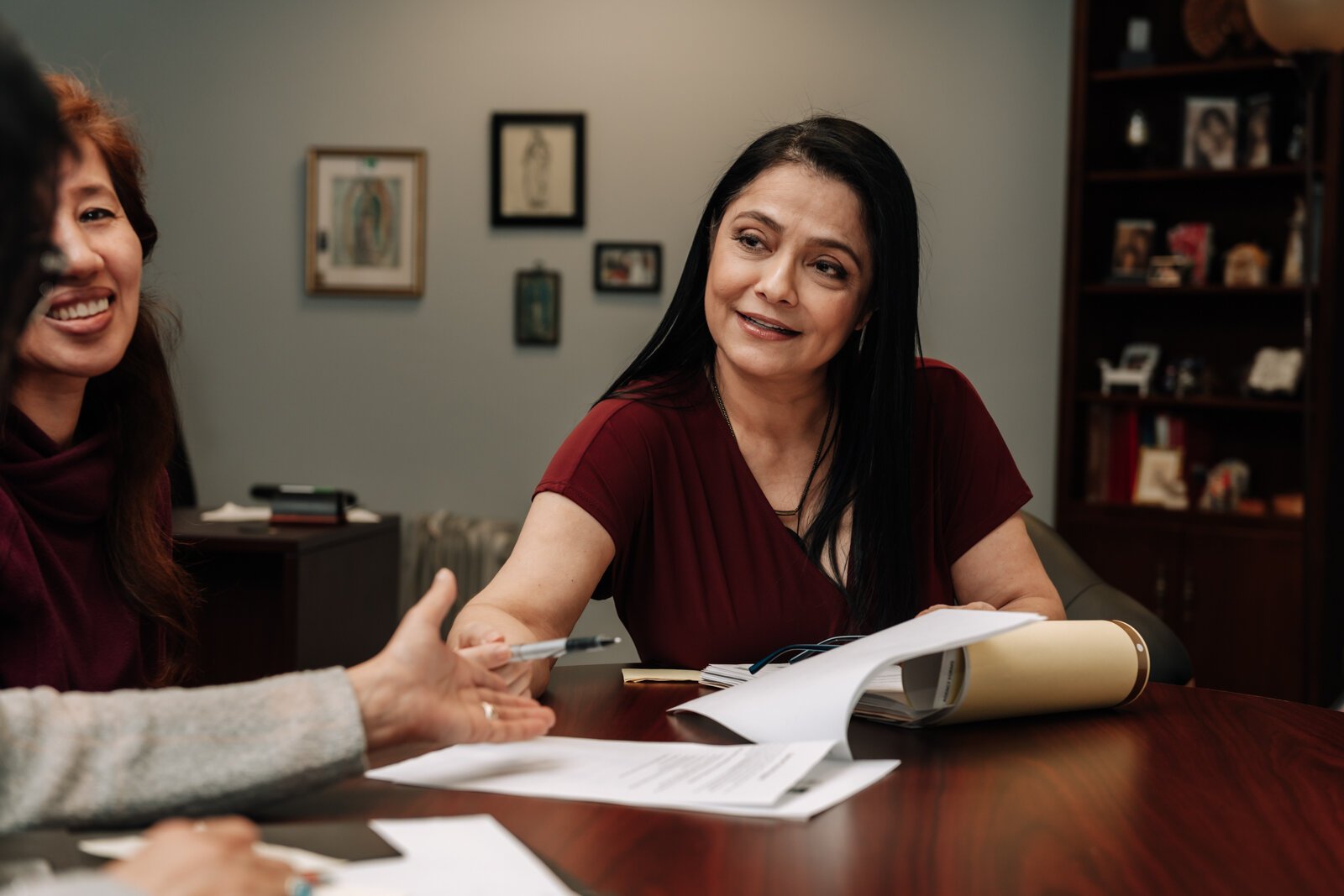 Luz Ostrognai with Catholic Charities demonstrates what a meeting with immigration clients would look like at the Archbishop Noll Catholic Center.