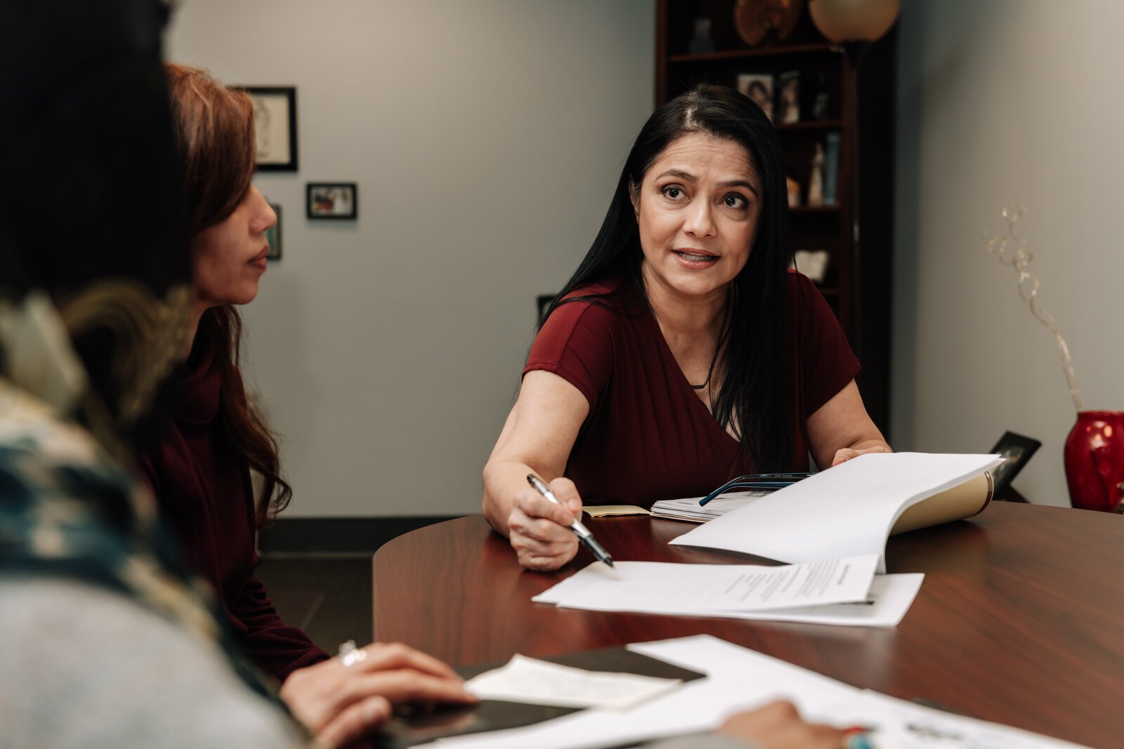 Luz Ostrognai with Catholic Charities demonstrates what a meeting with immigration clients would look like at the Archbishop Noll Catholic Center.