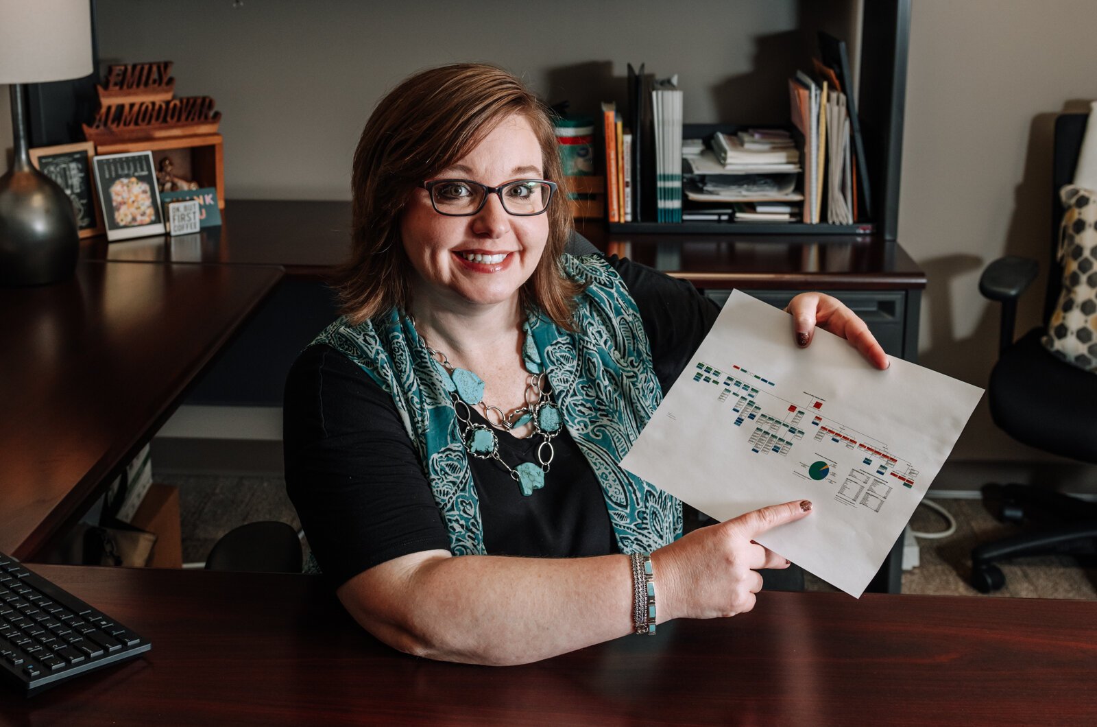 Emily Almodovar, Public Information Officer at Allen County, shows off a county government organizational chart.