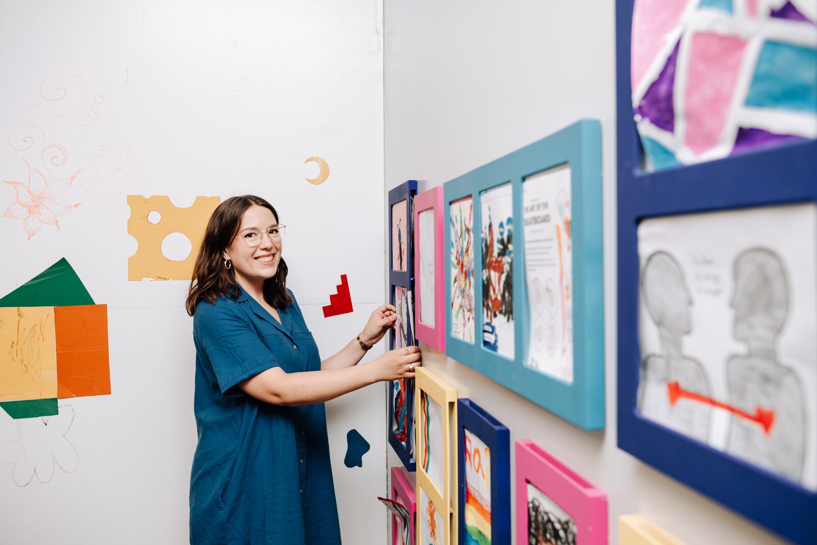 Alyssa Dumire, Director of Education, organizes works that visitors create while visiting The John S. and James L. Knight Learning Center at Fort Wayne Museum of Art.