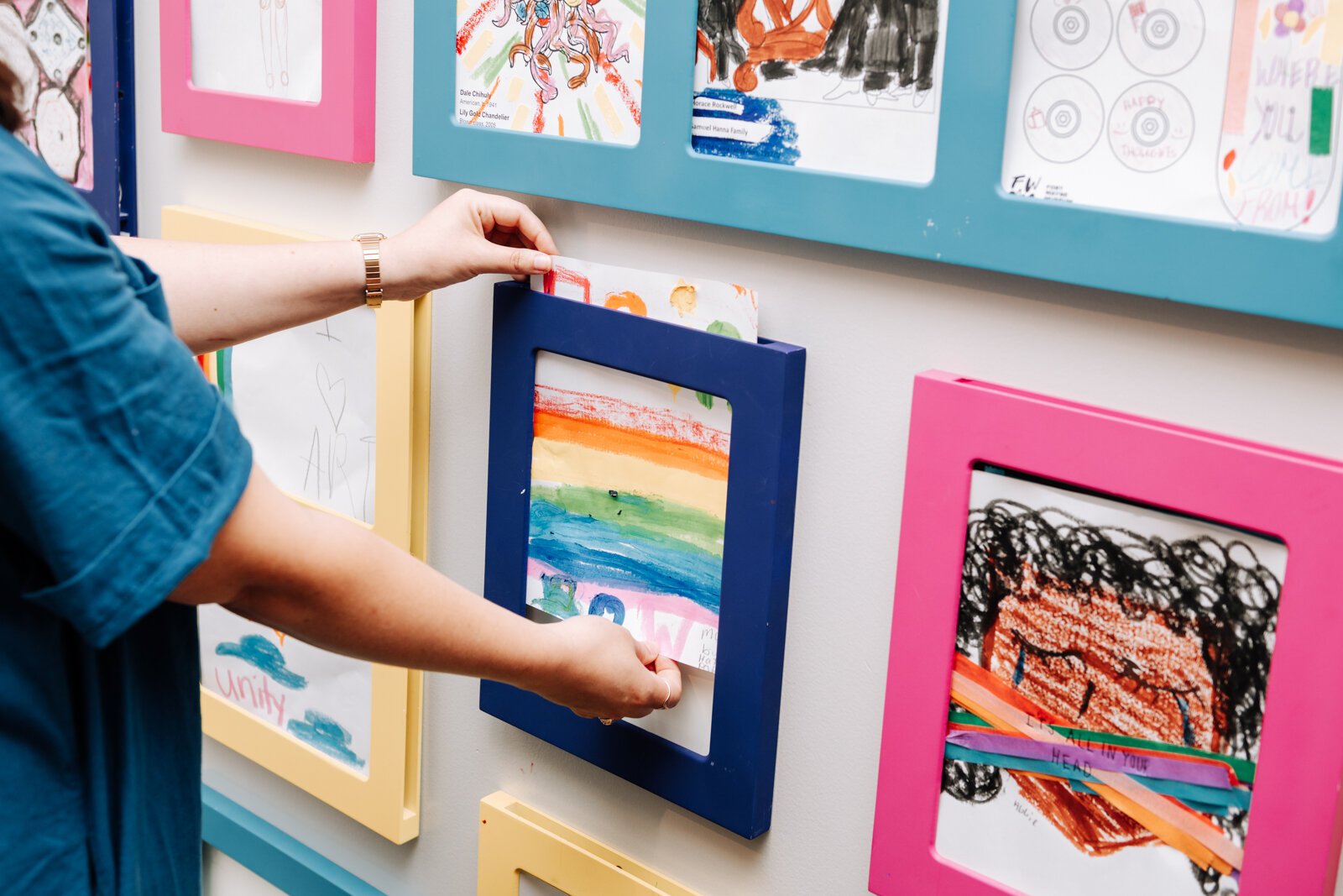 Alyssa Dumire, Director of Education, organizes works that visitors create while visiting The John S. and James L. Knight Learning Center at Fort Wayne Museum of Art.