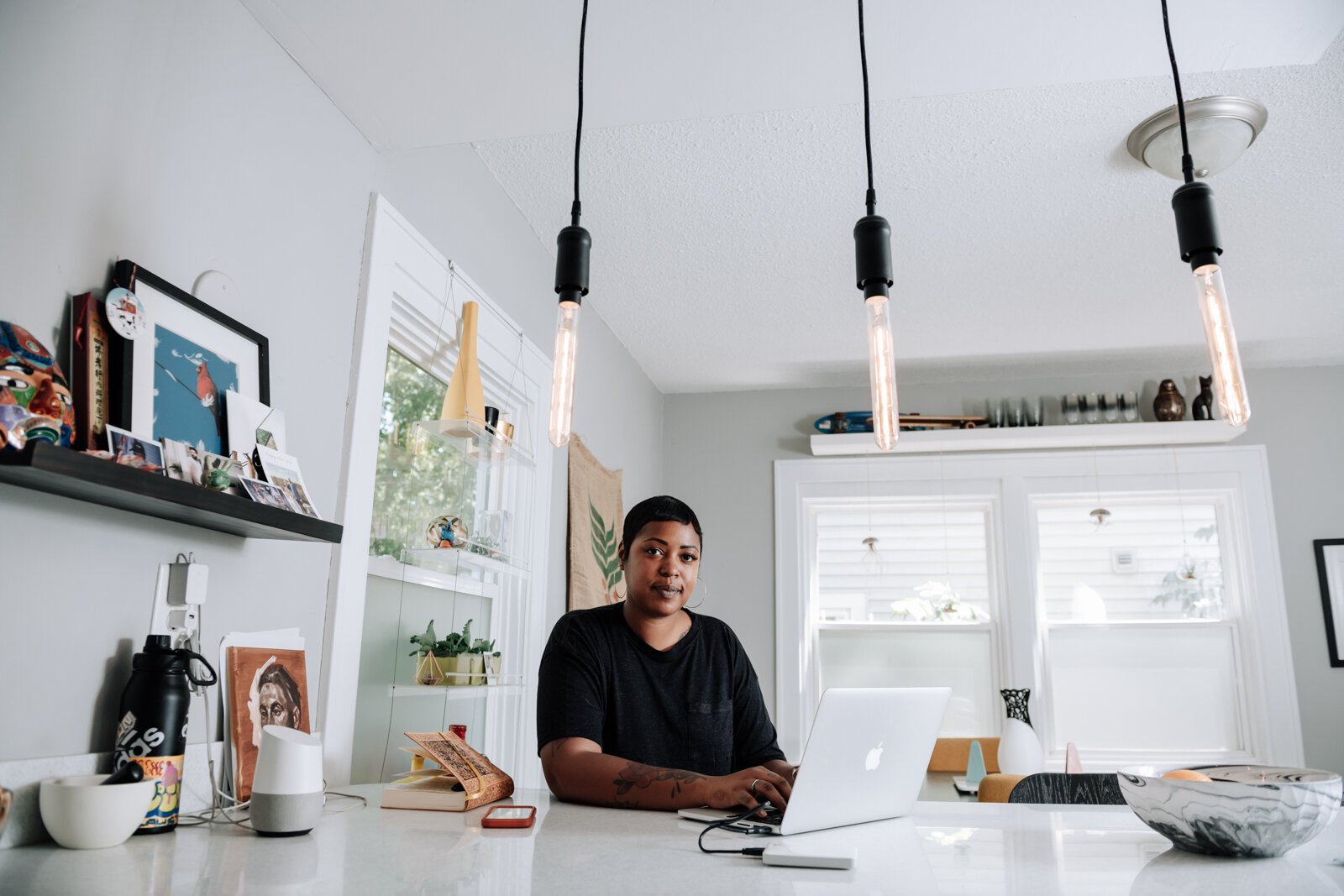 Creative Writer Shanel Turner works on writing in one of her favorite workspaces in the kitchen at her home in the '07.