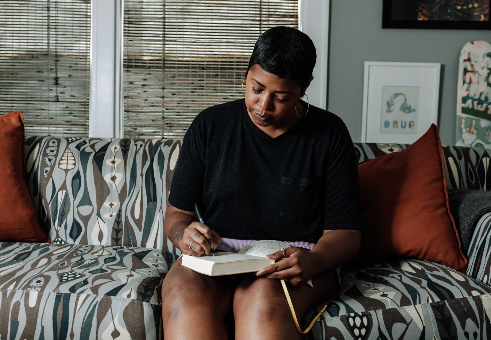 Creative Writer Shanel Turner works on writing in one of her favorite workspaces in the living room at her home in the '07.