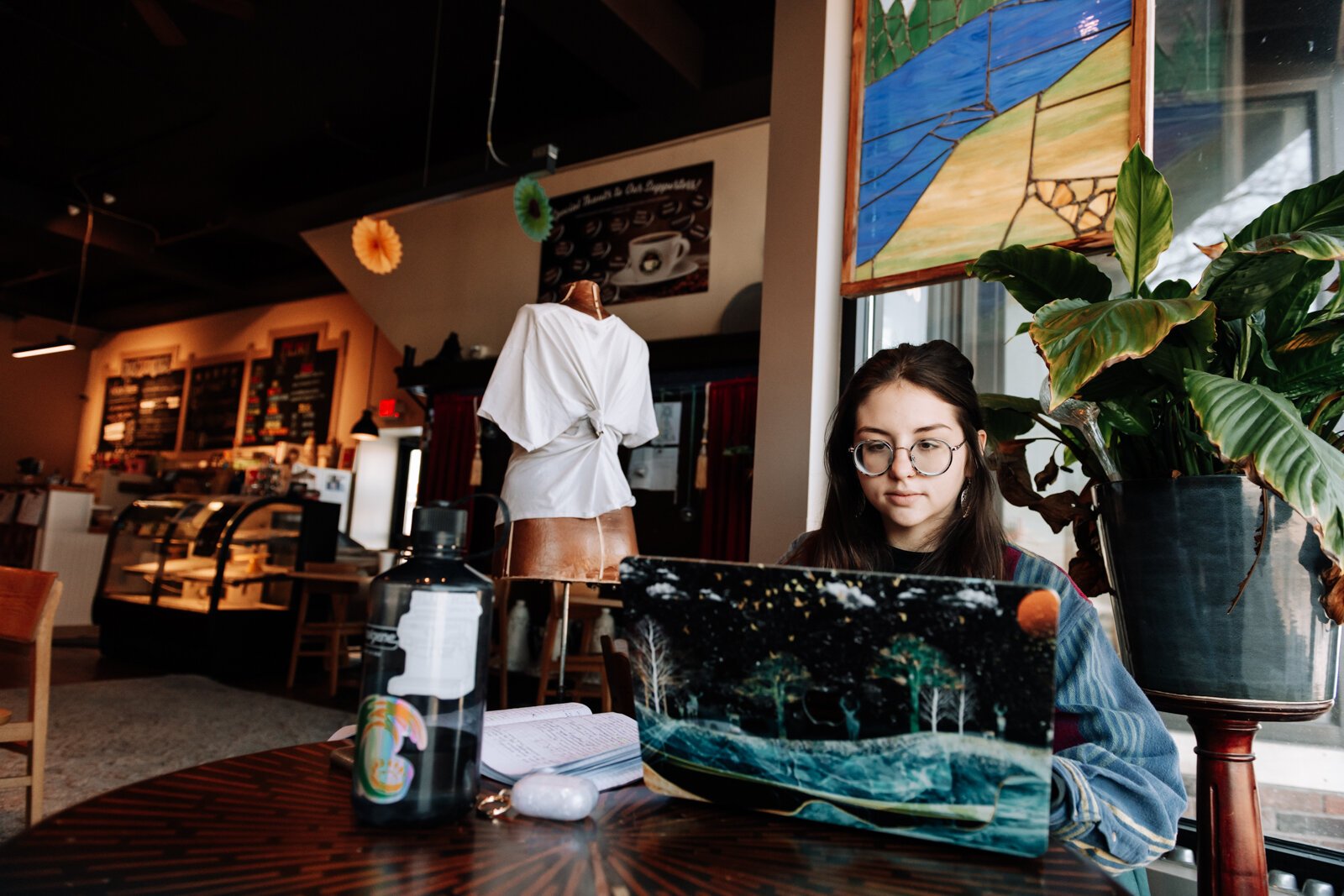 Ashley Sincoff works on schoolwork at Davey's Delicious Bagels, 1006 Broadway, Fort Wayne, IN 46802.