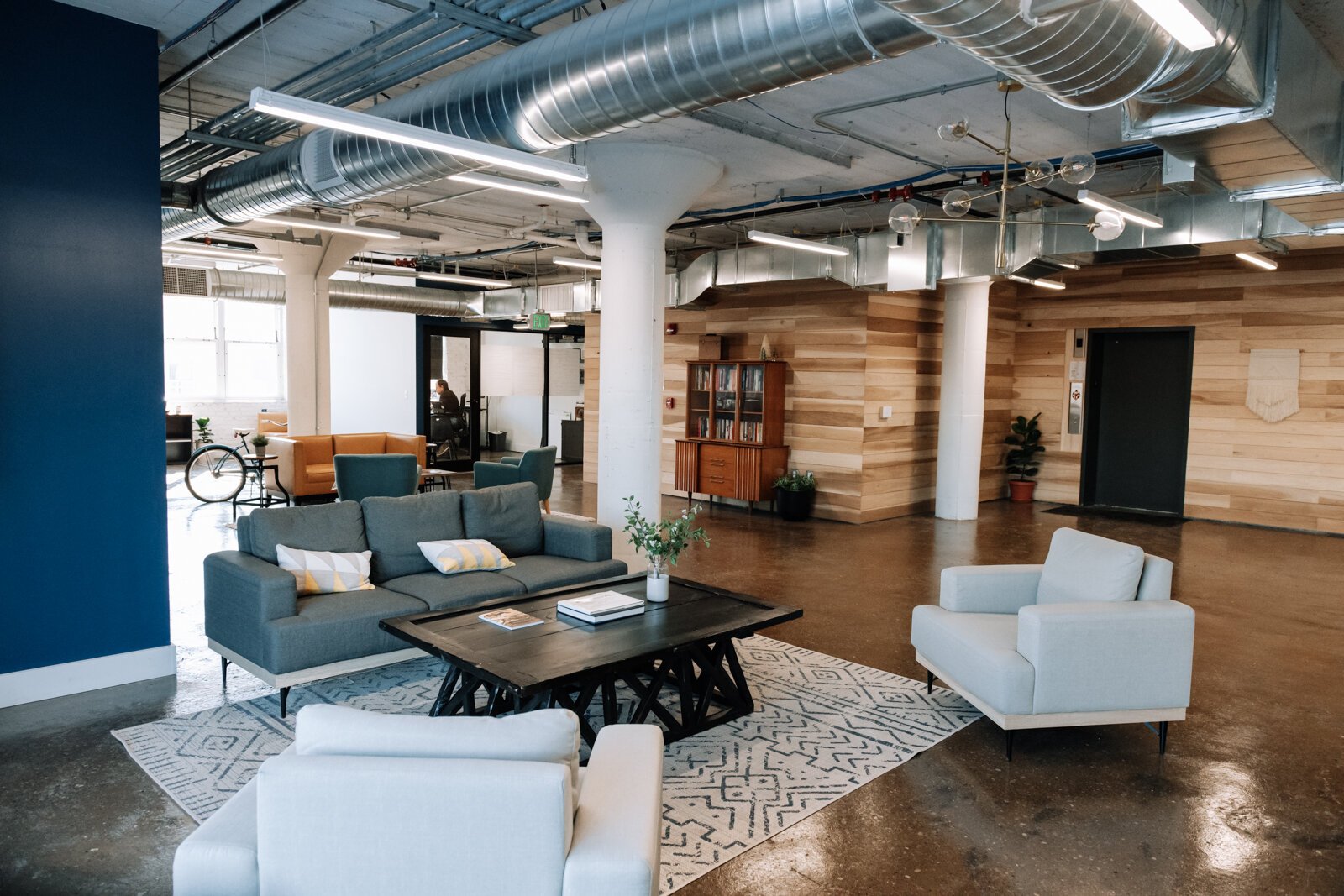 The co working space at Paper Mill Workspace is light and airy and features many different size offices as well as a conference room on the 4th floor above Utopian Coffee.