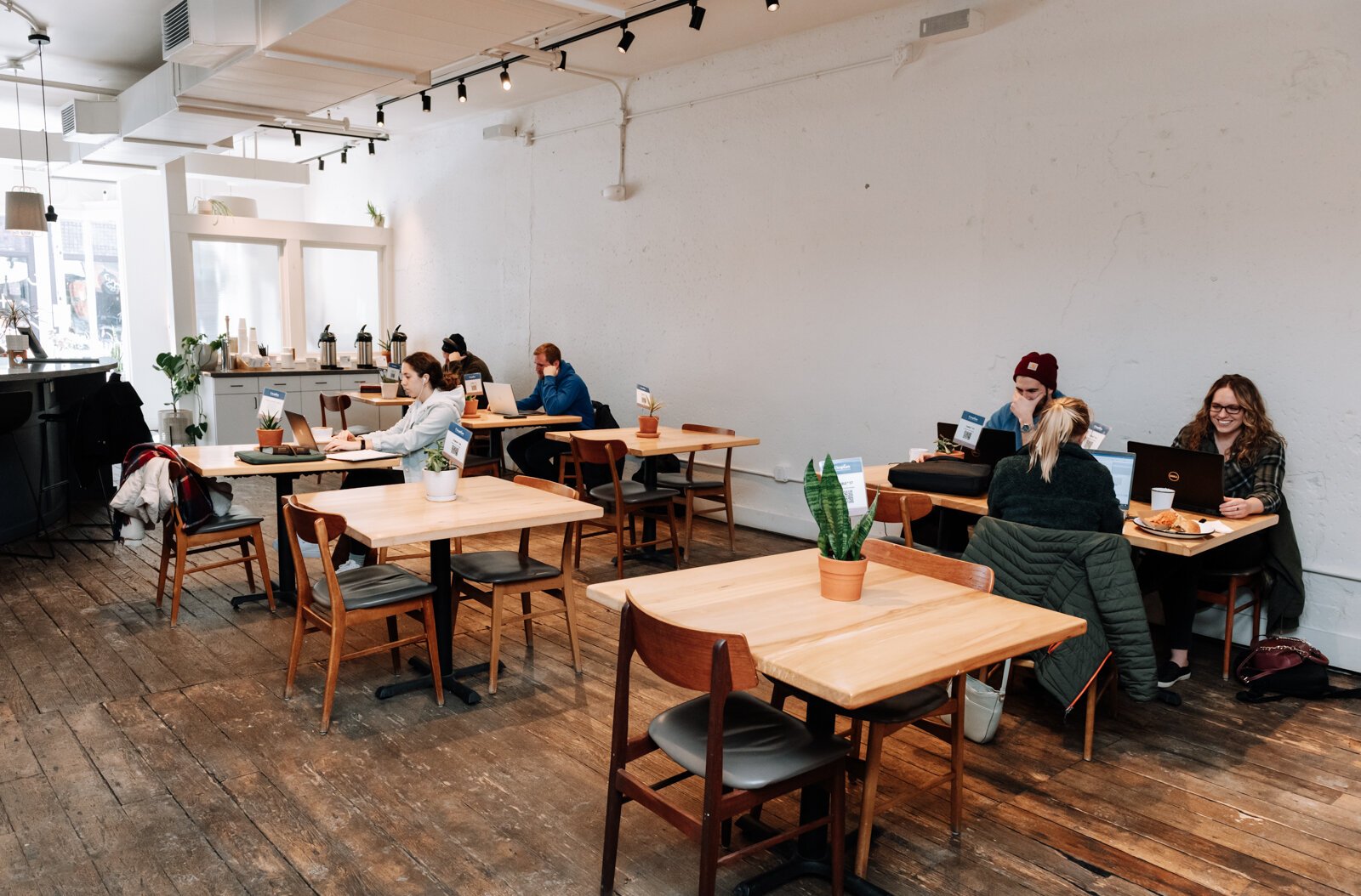 Guests work at the tables at Utopian Coffee.