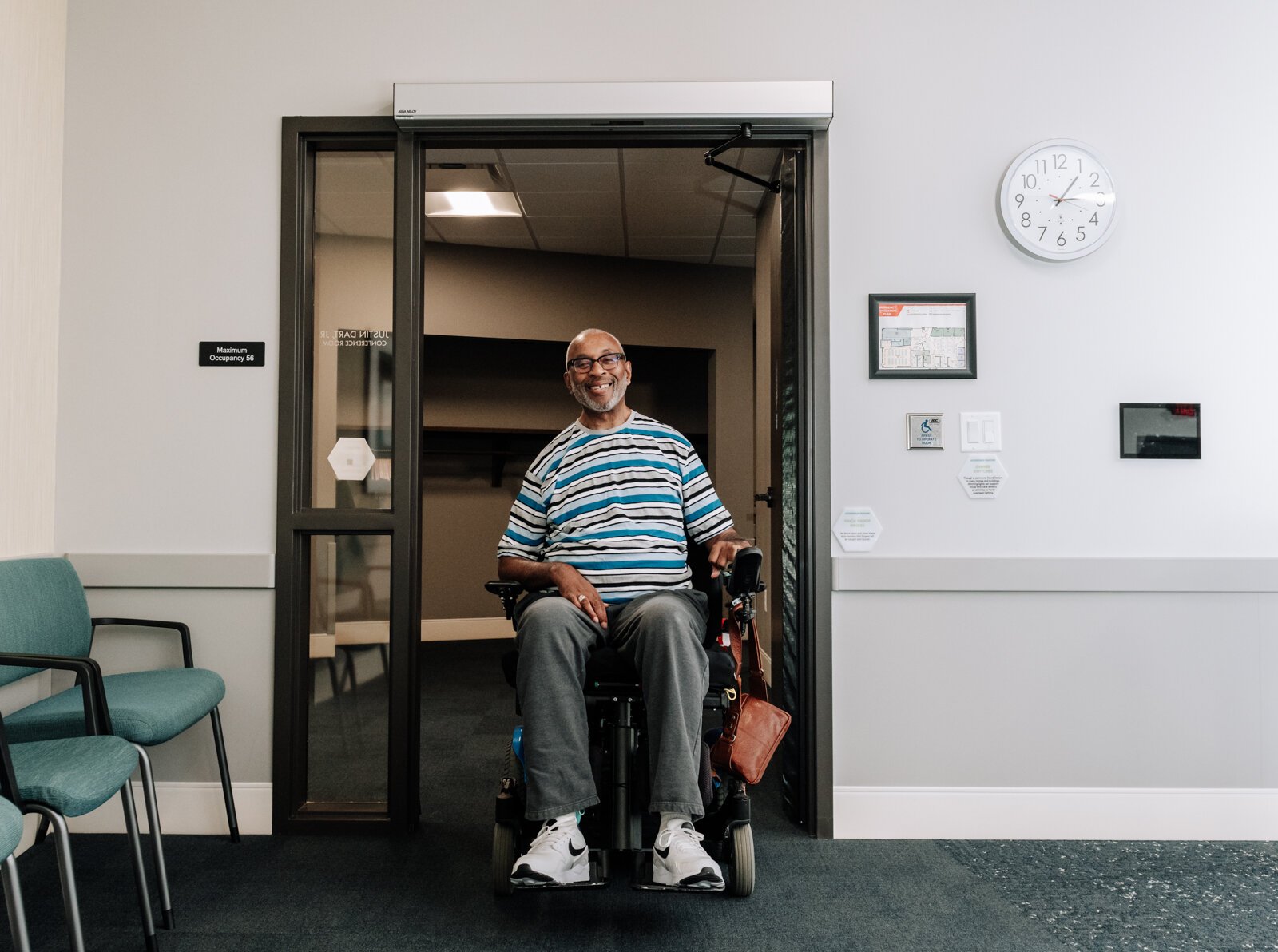 Clif Wallace showcases the extra wide doors suitable for wheelchairs while at the AWS Foundation.