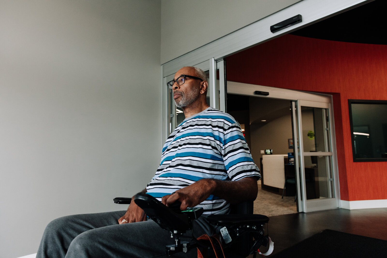 Clif Wallace showcases the extra wide doors suitable for wheelchairs while at the AWS Foundation.