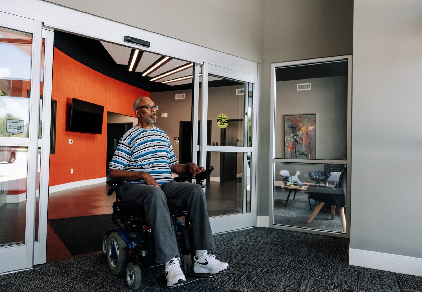 Clif Wallace showcases the extra wide doors suitable for wheelchairs while at the AWS Foundation.