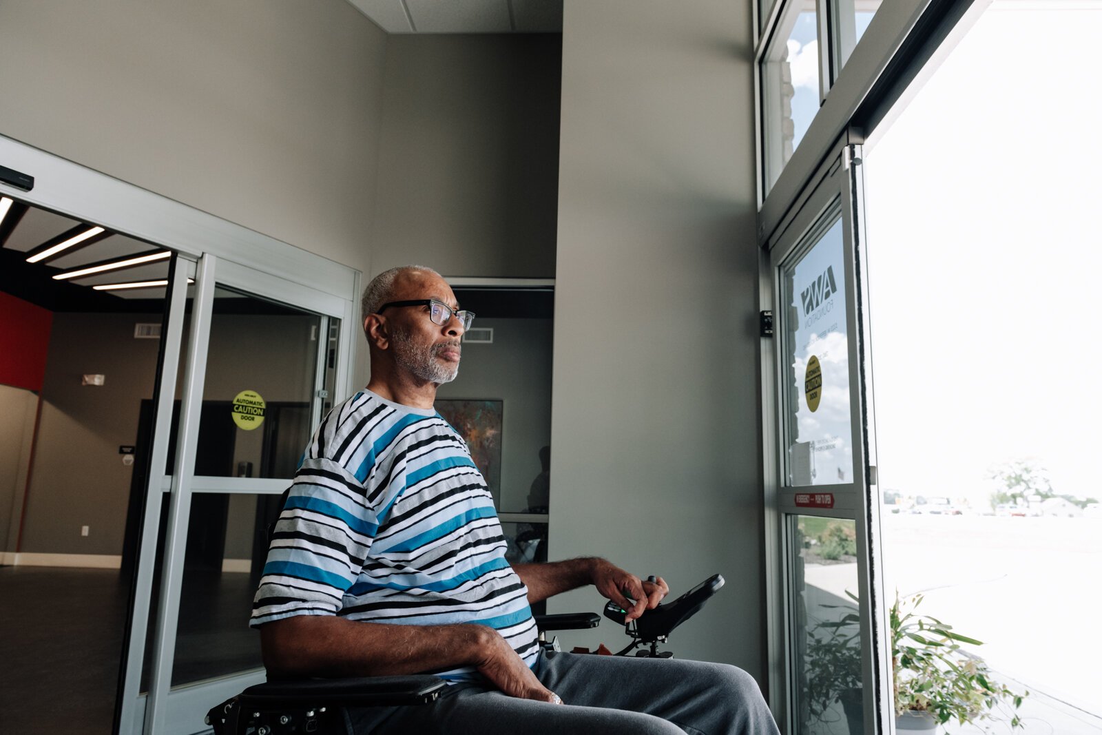 Clif Wallace showcases the extra wide doors suitable for wheelchairs while at the AWS Foundation.