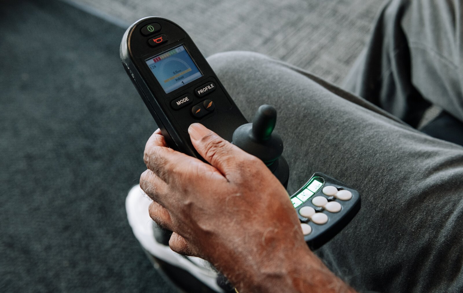 Clif Wallace uses the control on his wheelchair while at the AWS Foundation.