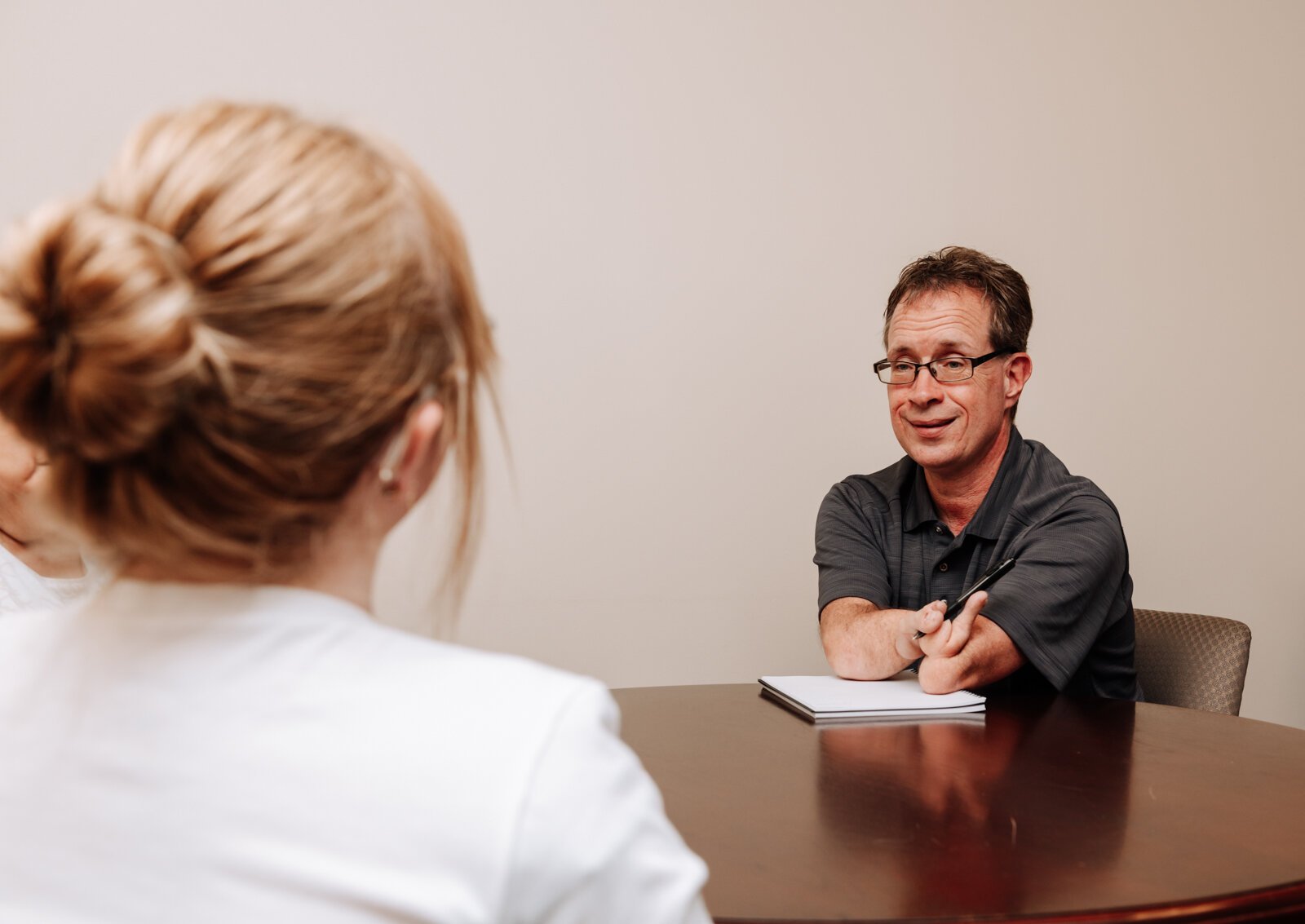 John Guingrich and Moriah Backhaus talk during a work meeting at The League For the Blind - Disabled.