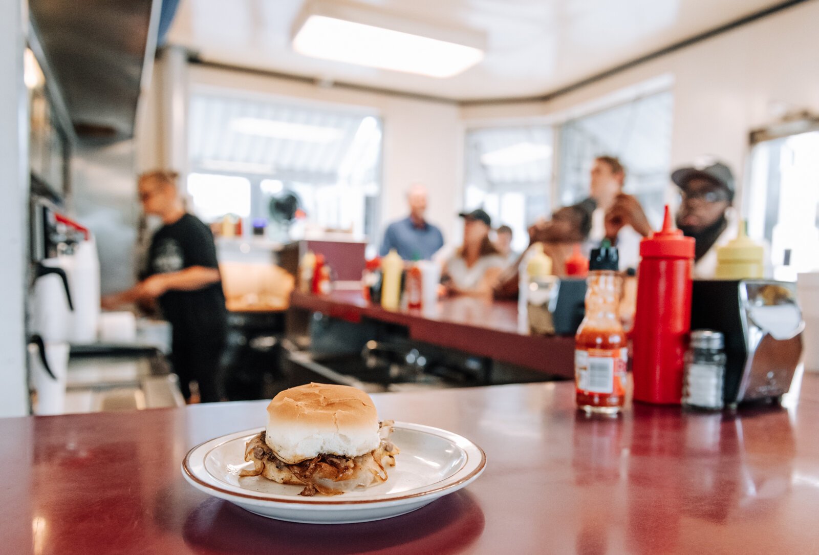 The Powers slider with onions and cheese at Powers Hamburger Restaurant, 1402 S. Harrison.