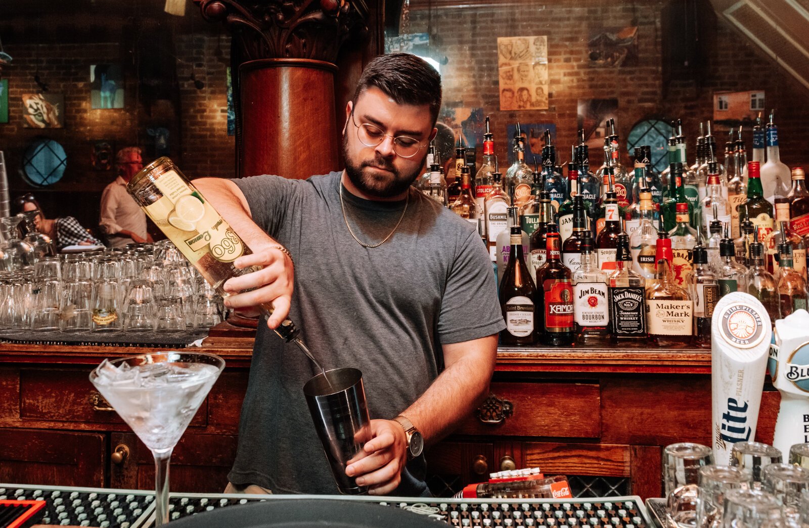 Bartender Brandon England makes a cosmo at Henry's Restaurant, 536 W. Main St.