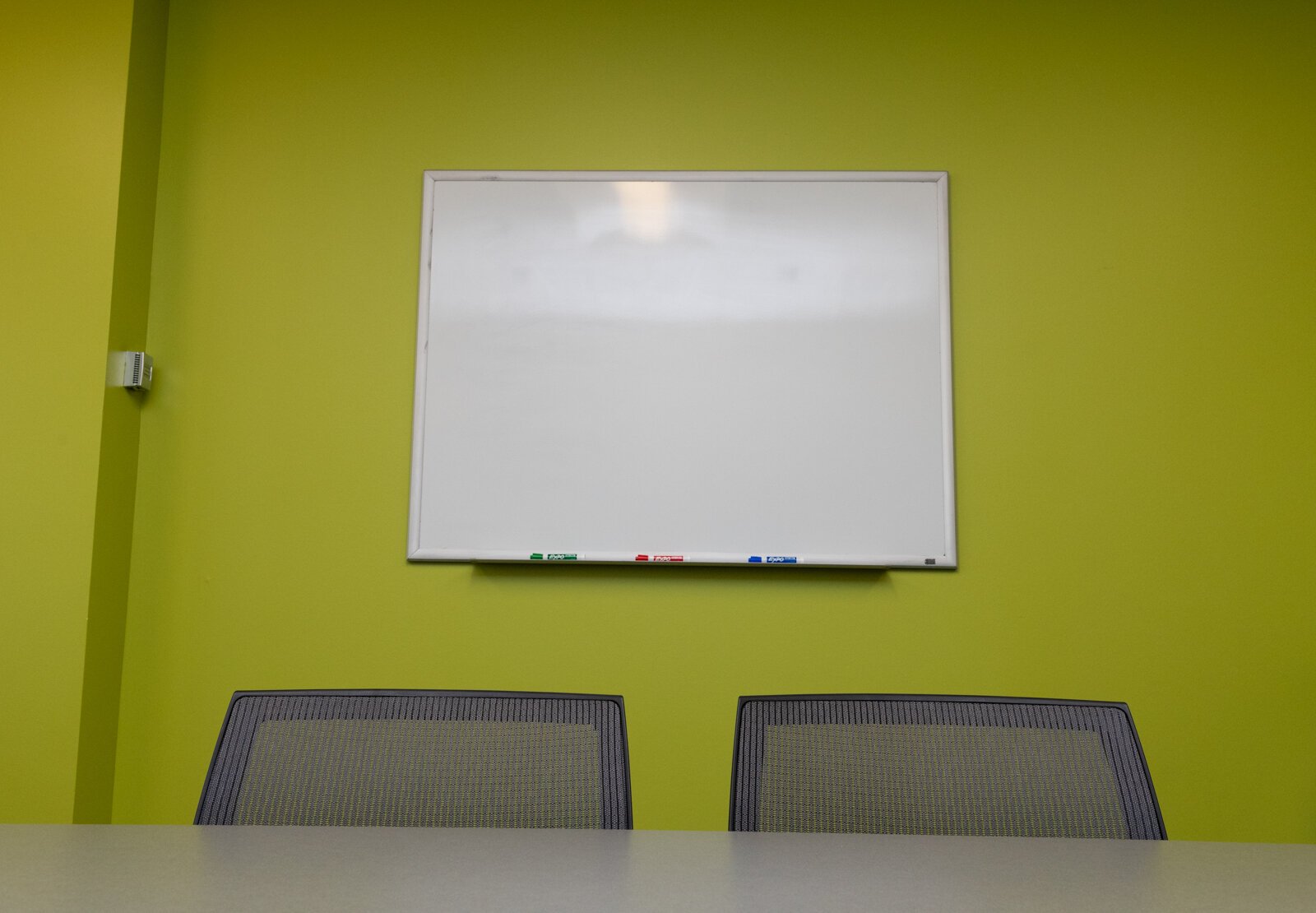 A conference room features a pop of color at Greater Fort Wayne, Inc.