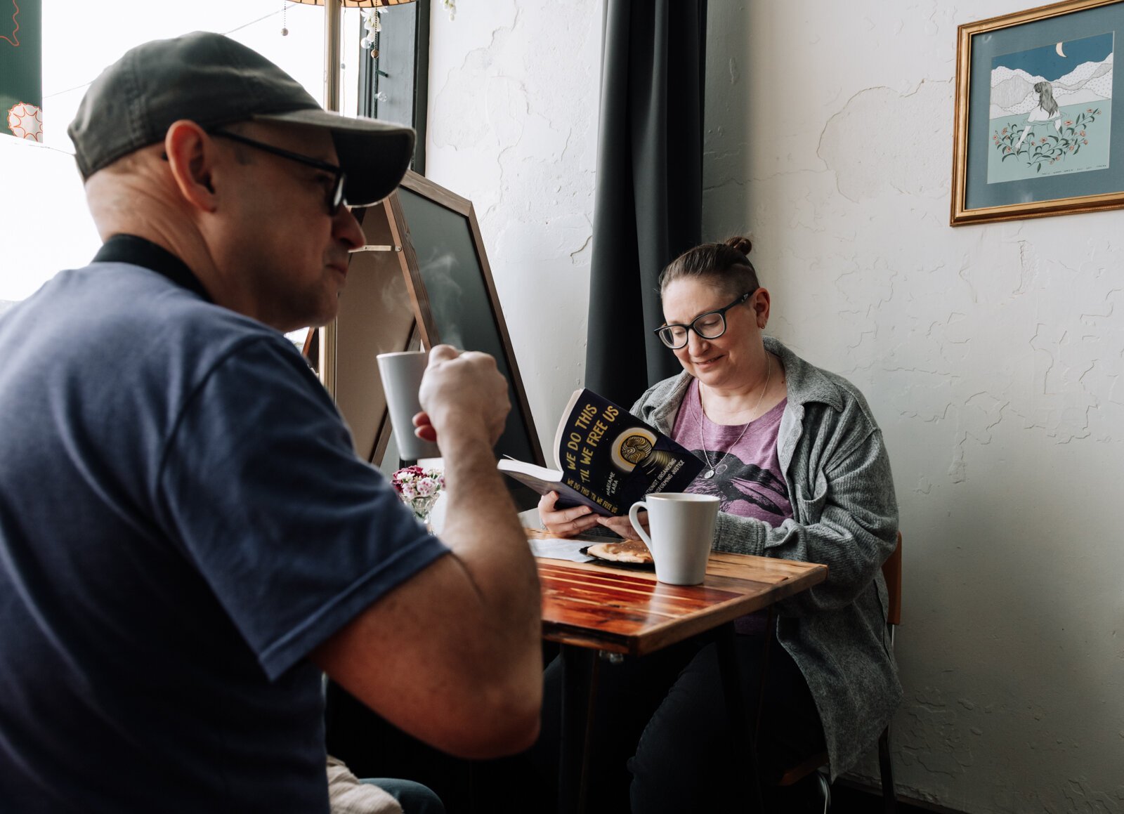 Sara Ofner-Seals, right, and Barrett Seals enjoy baked goods and the atmosphere at Good Bread for All.