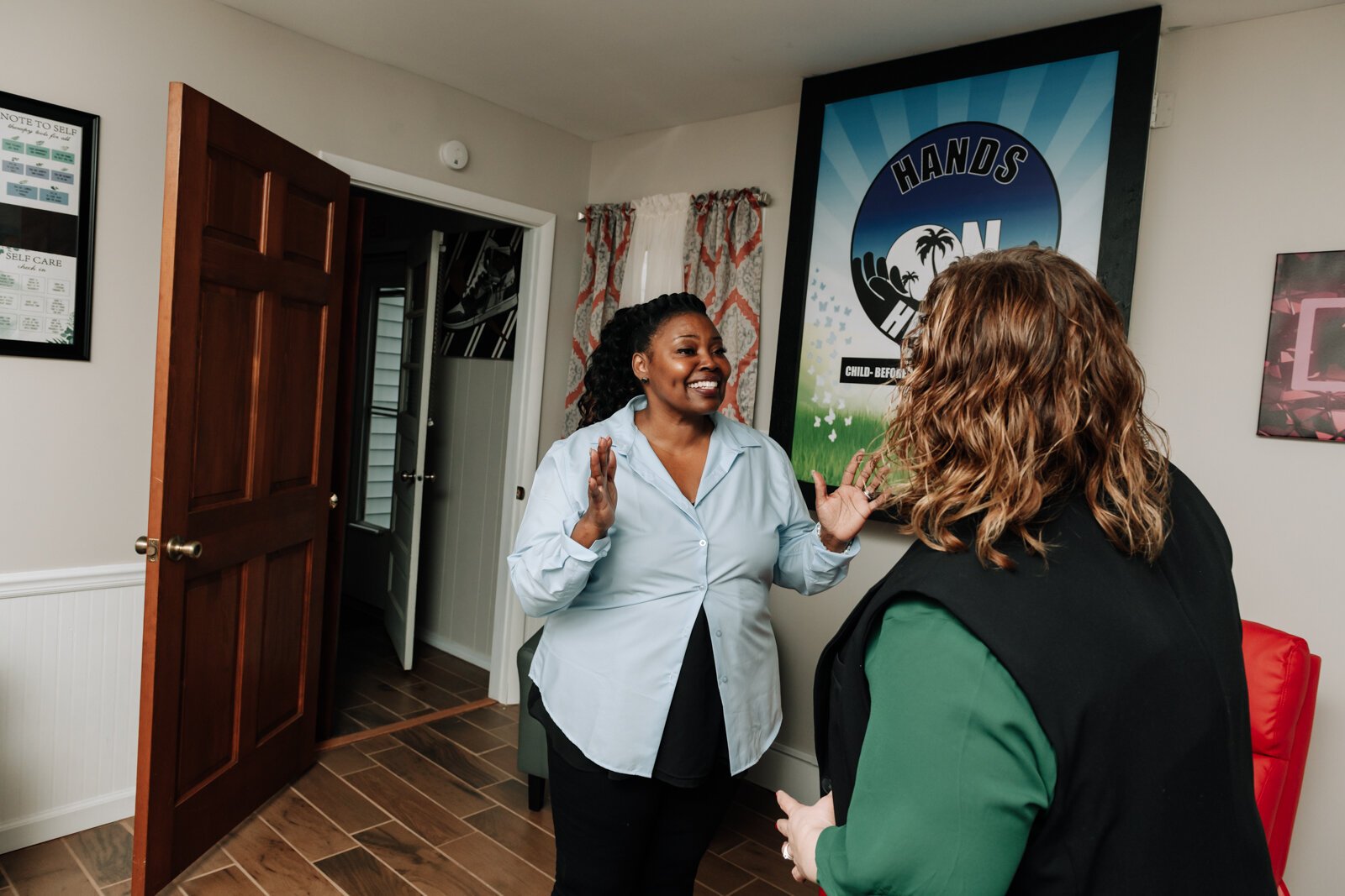 Regenia Jones, left, with Casey Claypool during the open house and ribbon cutting of Hands on Haven Inc.