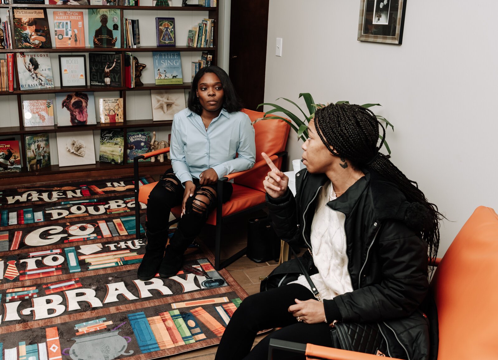 Lauryn Jones, left, chats with ShaTearaney Suttle during the open house and ribbon cutting of Hands on Haven Inc.