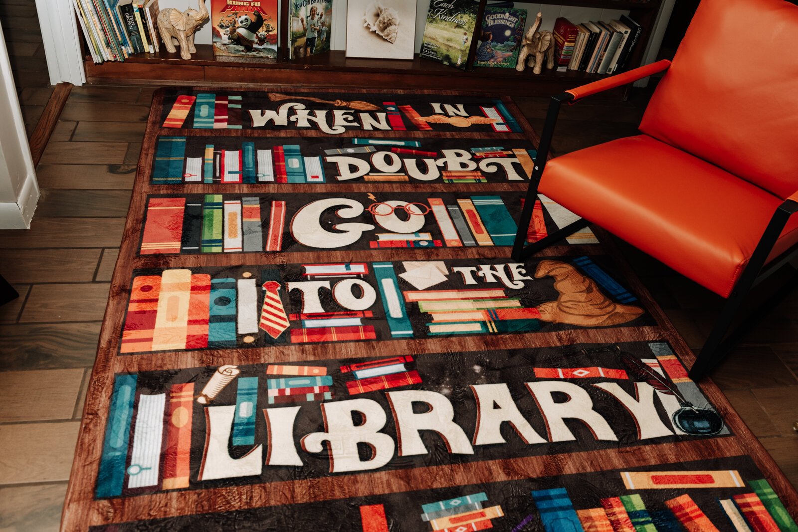 The rug in front of the media wall at Hands on Haven Inc.