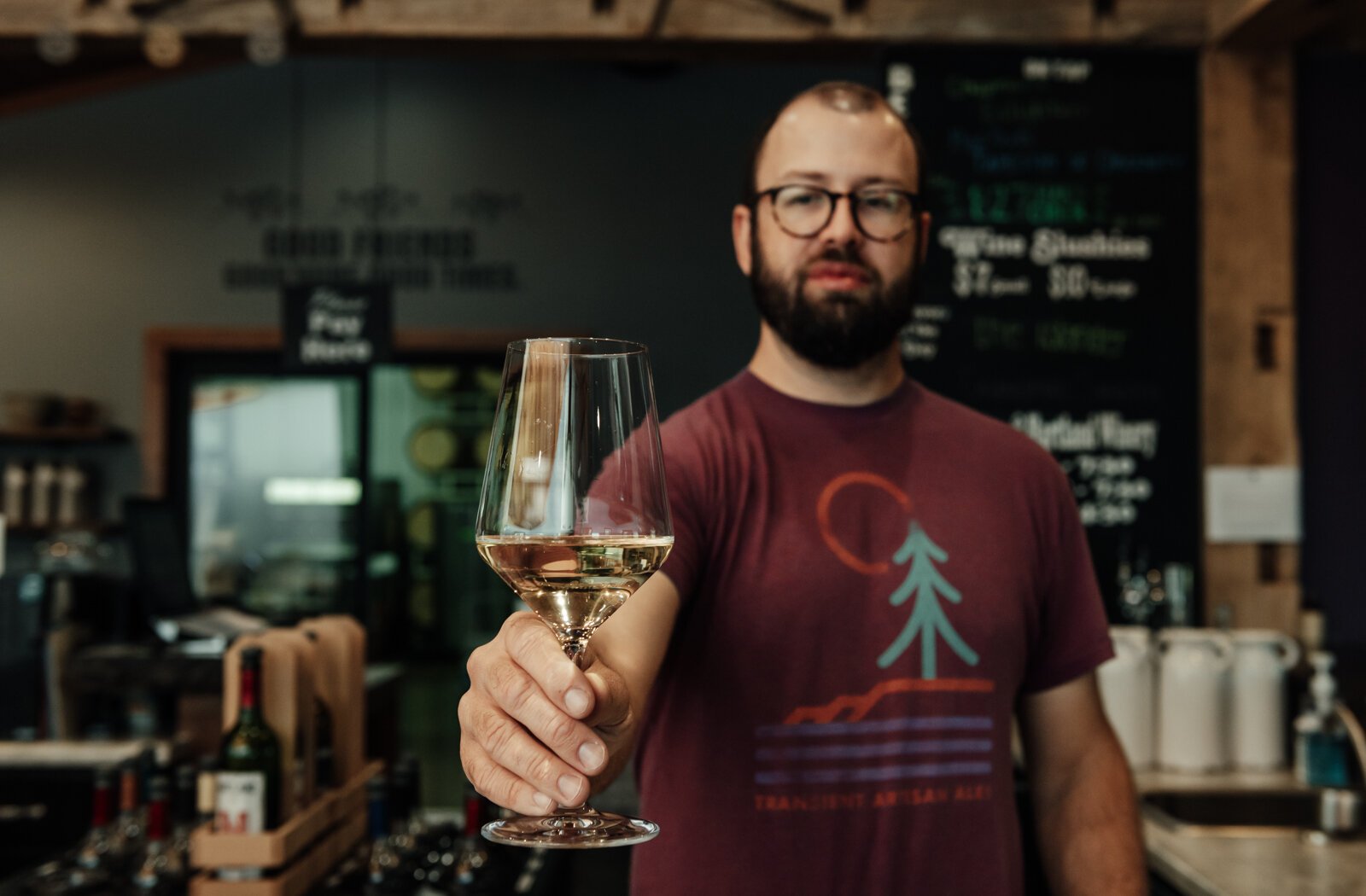 inemaker Kirk Etheridge pours an estate grown Lacrescent at Hartland Winery in Ashley, IN.