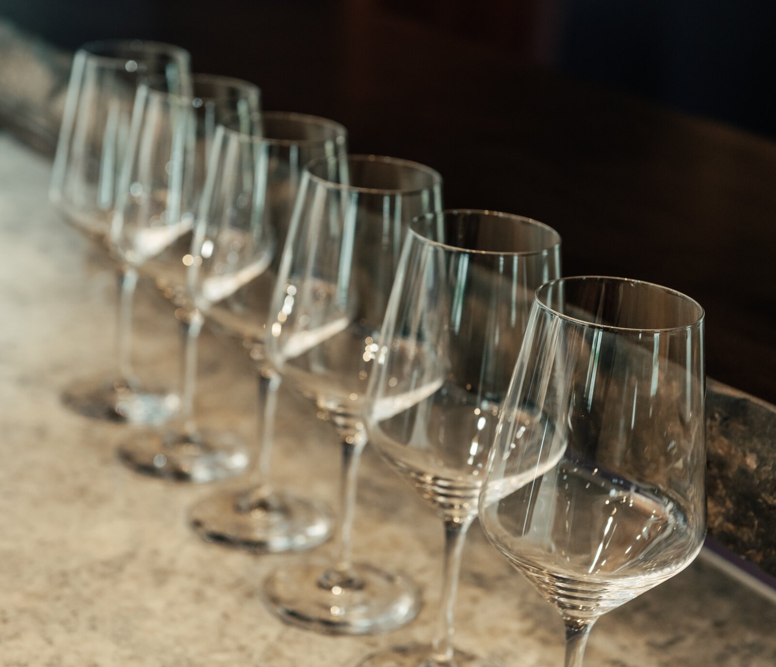 Wine glasses on the counter at Hartland Winery.