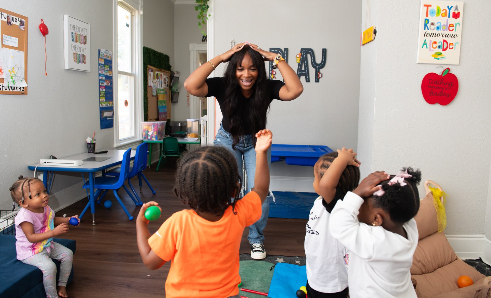 Janae Dubose, owner of Little Achievers Home Daycare Kindergarten Prep,  leads Circle Time featuring songs and music with her students.