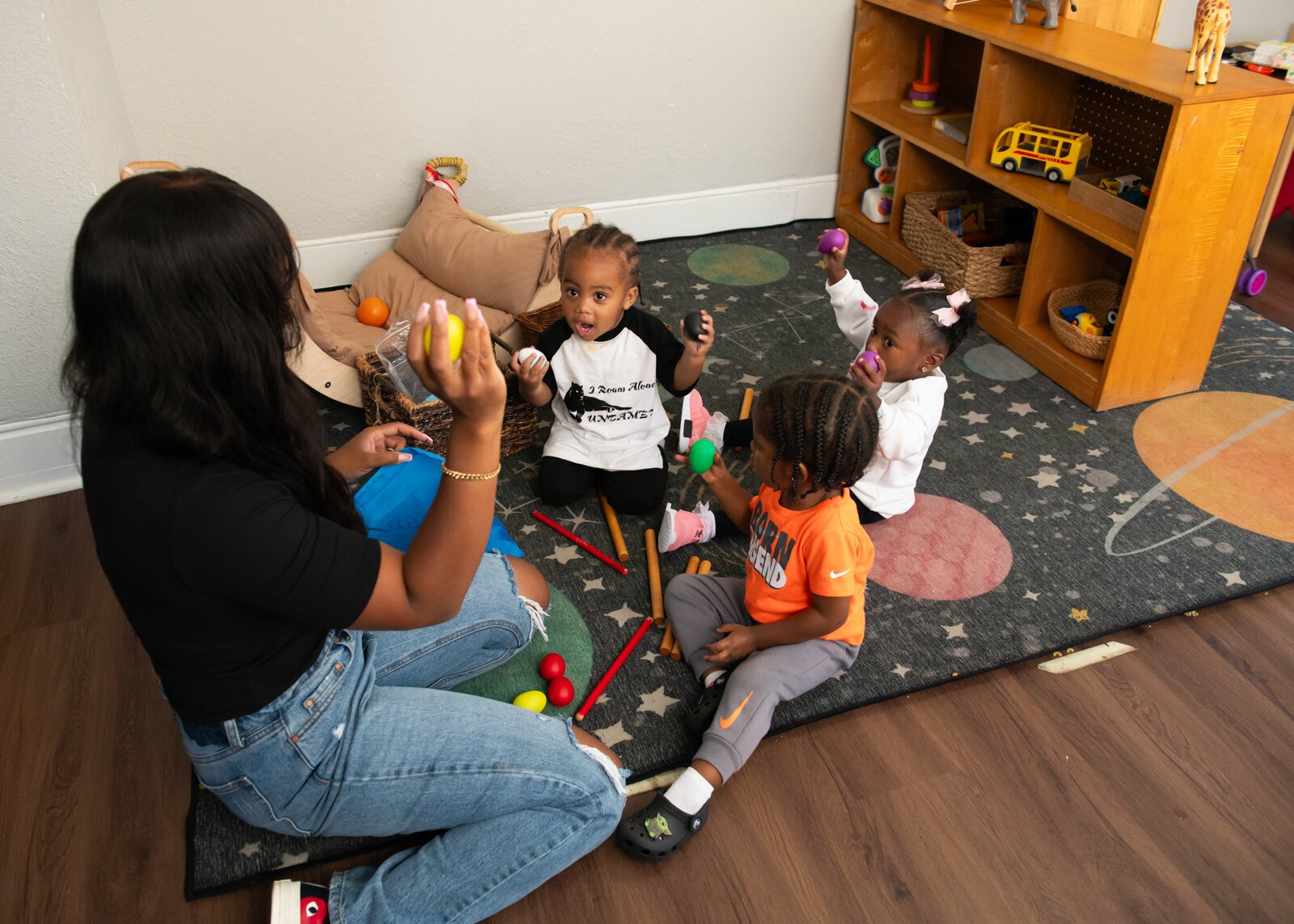 Janae Dubose, owner of Little Achievers Home Daycare Kindergarten Prep,  leads Circle Time featuring songs and music with her students.