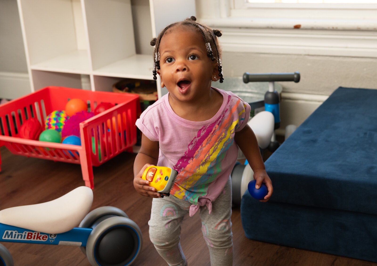 Jorja, enjoys a song and dance activity at Little Achievers Home Daycare Kindergarten Prep.