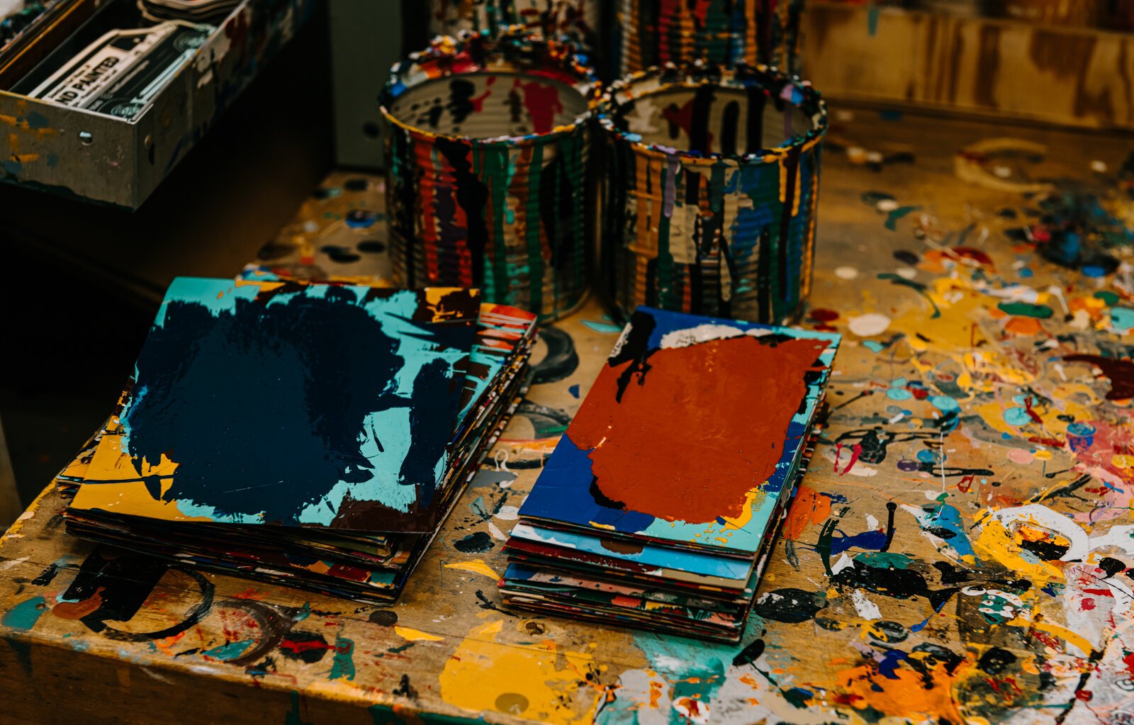 Used paint palettes in Justin Lim's shop.