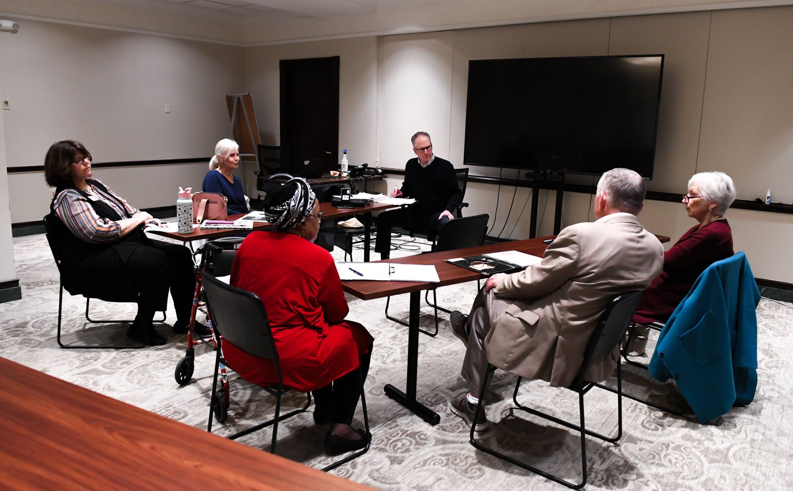 Members of the Mayor's Age-Friendly Council discuss issues during their meeting at Citizen's Square.