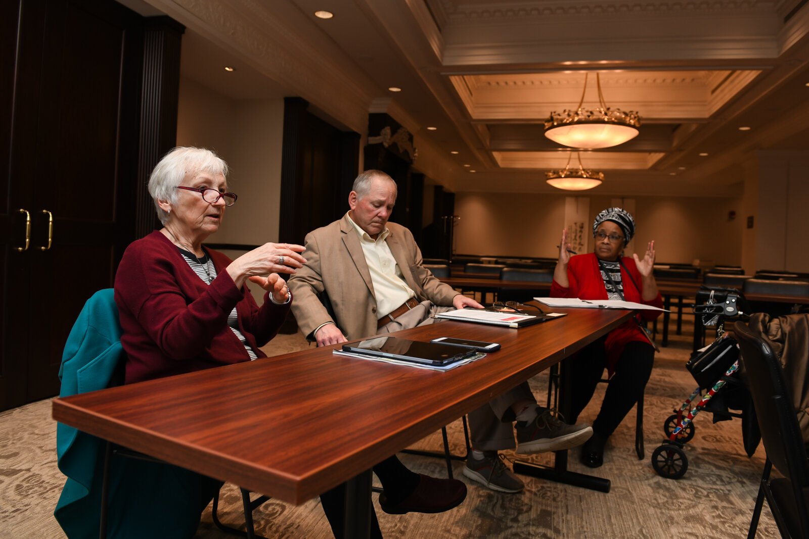 Becky Weimerskirch, left, speaks during a council meeting with members of the Mayor's Age-Friendly Council at Citizen's Square.