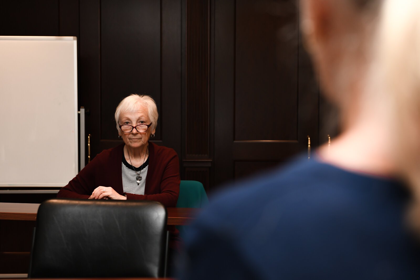 Becky Weimerskirch listens to another member speak during a council meeting with members of the Mayor's Age-Friendly Council at Citizen's Square.