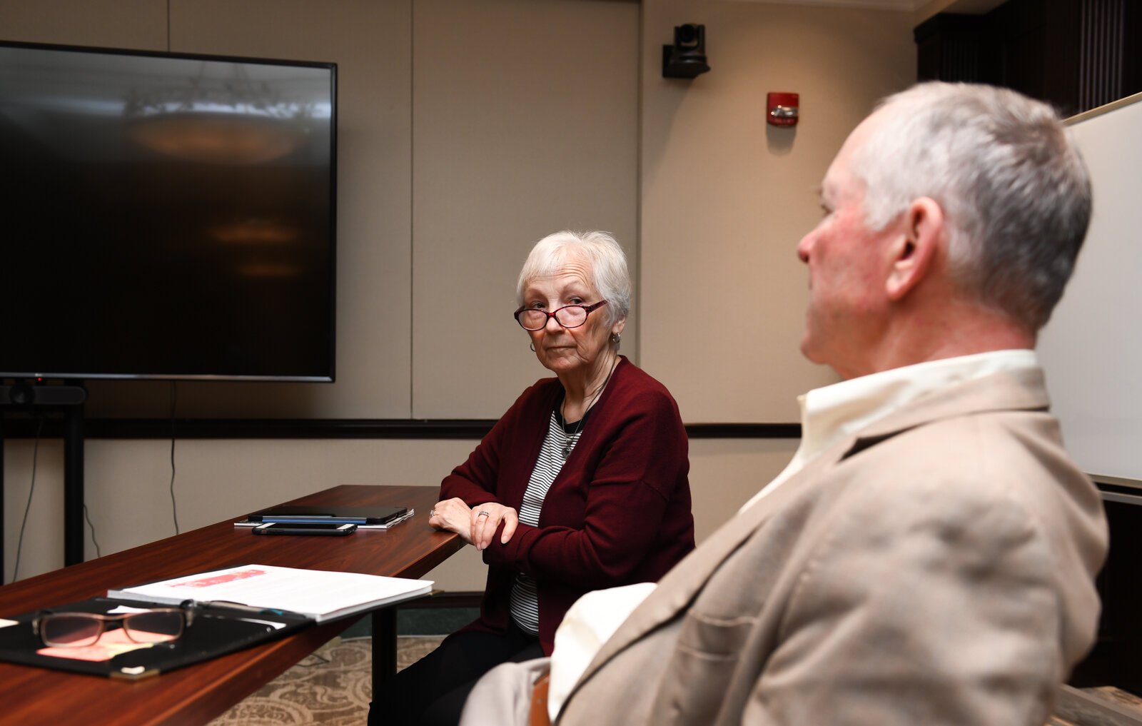 Becky Weimerskirch, left, listens to John P. Gardner speak during a council meeting with members of the Mayor's Age-Friendly Council at Citizen's Square.