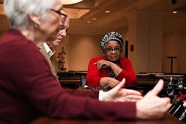 Denise Porter listens to other members during a council meeting with members of the Mayor's Age-Friendly Council at Citizen's Square.