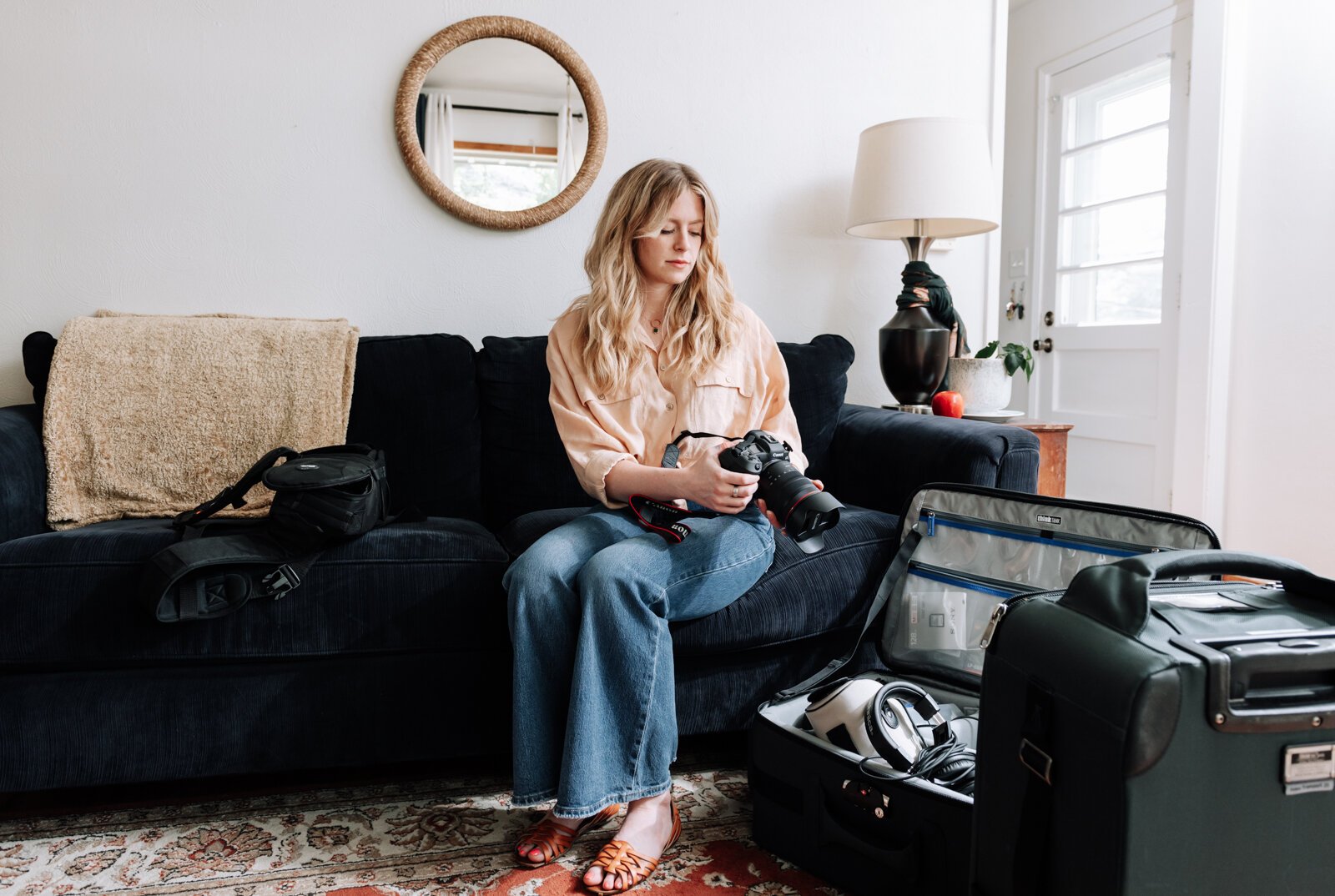 Jordan Bishop, an employee at Bowen Center, works on collecting gear for her next photoshoot for Bowen Center, at her home.