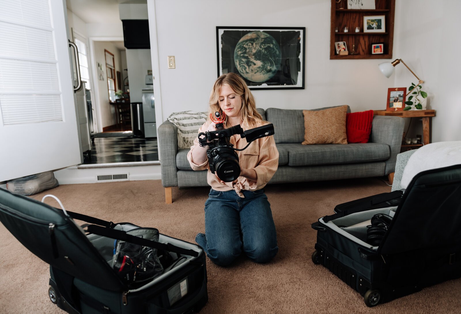 Jordan Bishop, an employee at Bowen Center, works on collecting gear for her next photoshoot for Bowen Center, at her home.