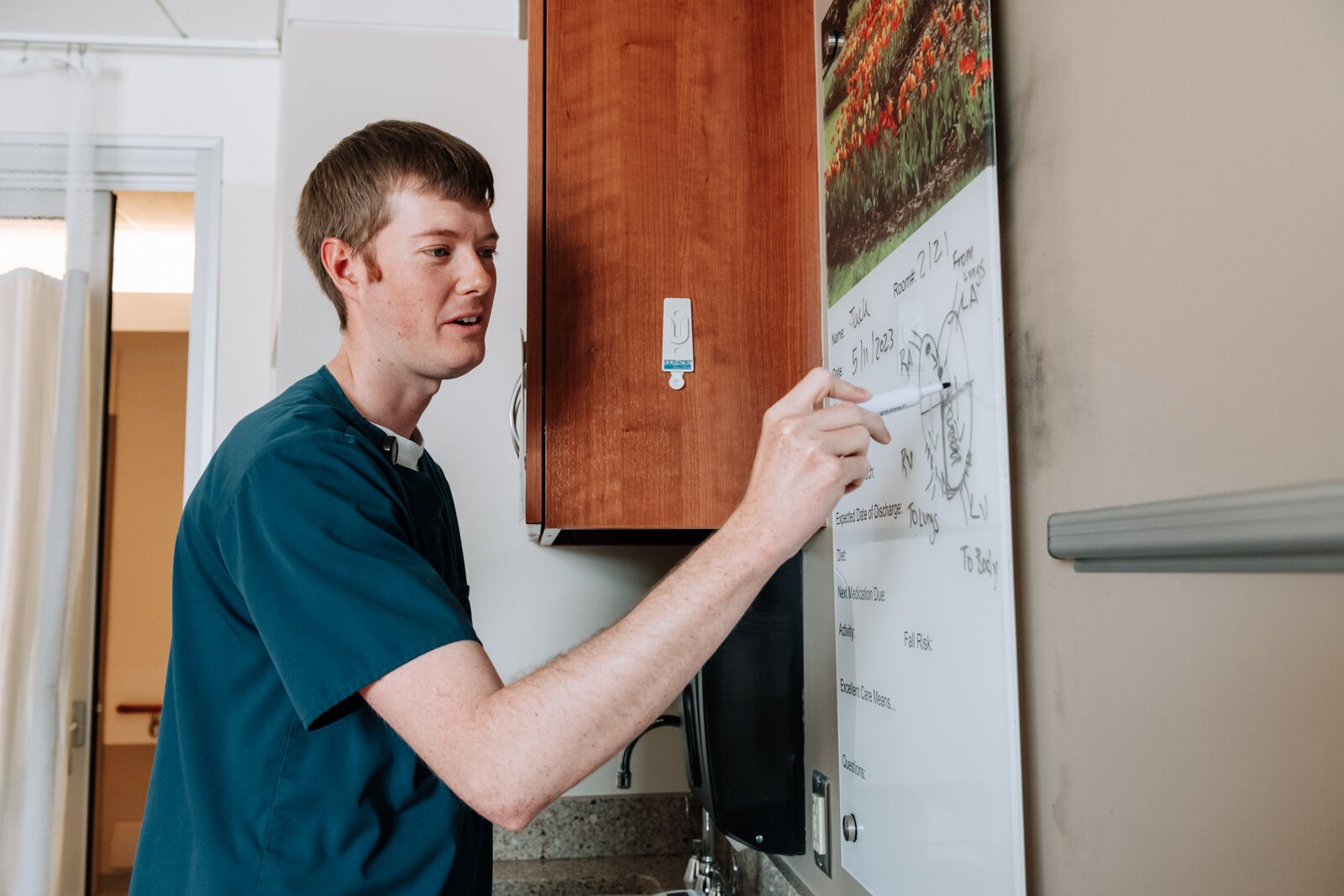 Colin Fassold, Registered Nurse, shows how he gives a visual to patients to help them at Parkview Regional Medical Center.