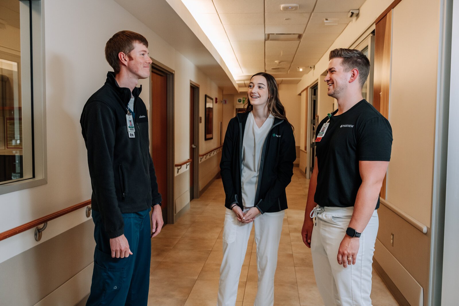 From left: Colin Fassold, Registered Nurse, Bryn Benzing, Student Nurse Assistant, and Jayce Colclasure, Student Nurse Apprentice walk the halls at Parkview Regional Medical Center.