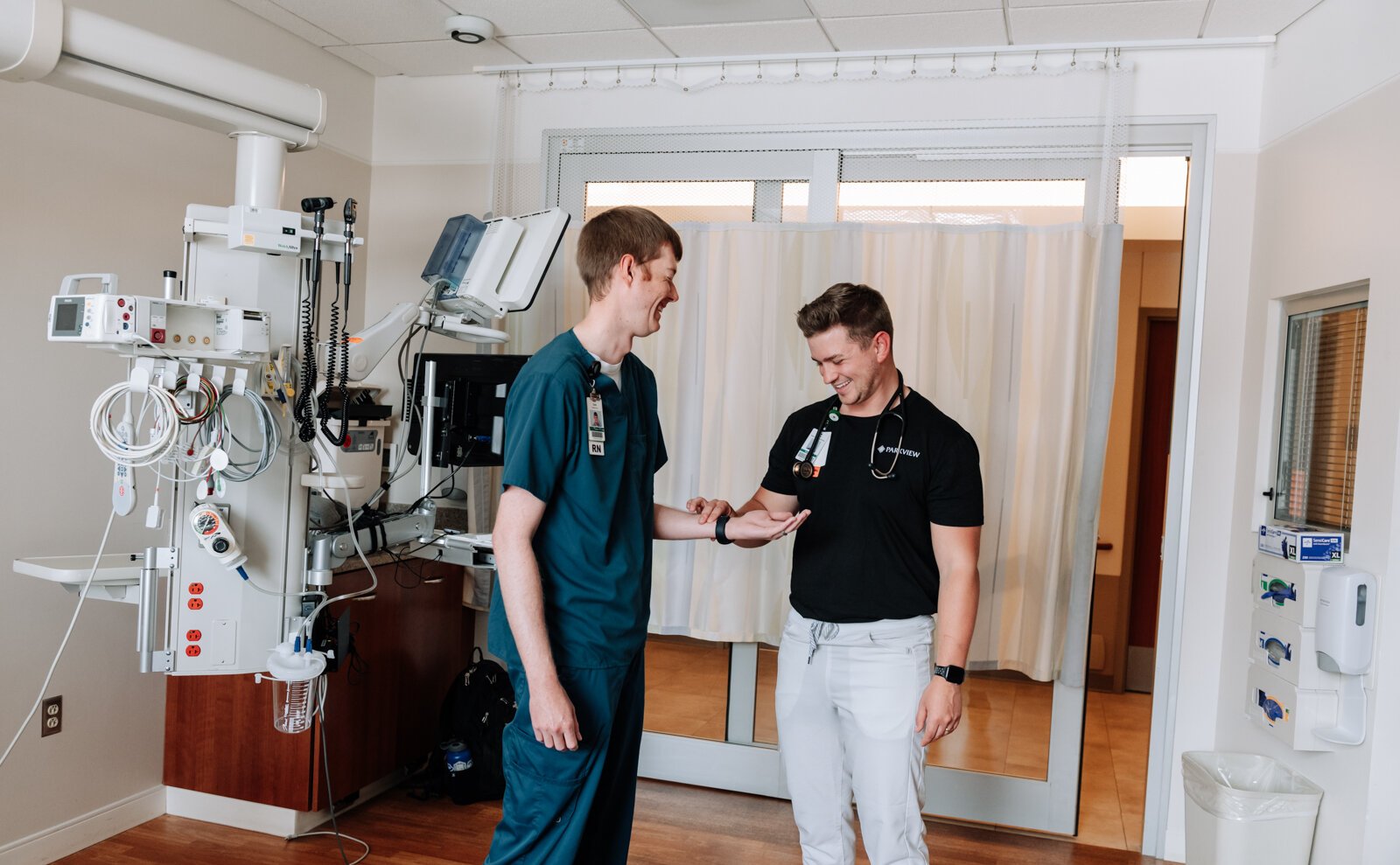 Jayce Colclasure, Student Nurse Apprentice, right, practices an assessment with his mentor Colin Fassold, Registered Nurse at Parkview Regional Medical Center.