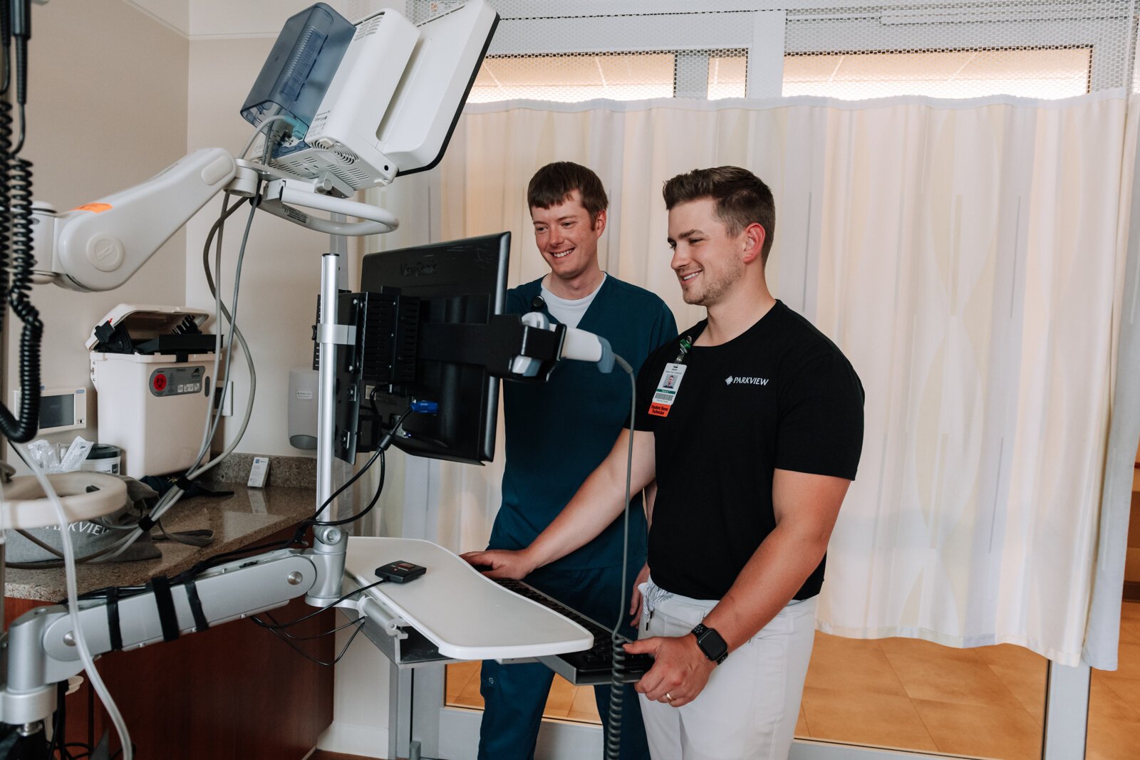 Jayce Colclasure, Student Nurse Apprentice, right, works on charting with his mentor Colin Fassold, Registered Nurse at Parkview Regional Medical Center.